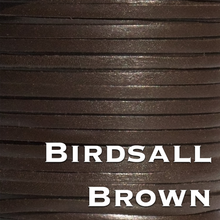 Load image into Gallery viewer, a close up of a spool of brown thread