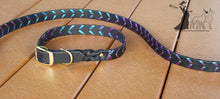 Load image into Gallery viewer, a dog collar and leash on a wooden floor