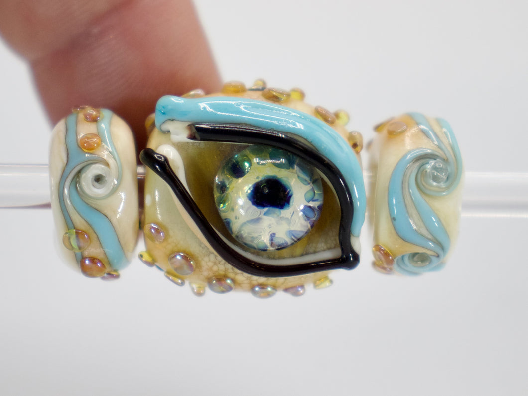 a close up of a bead with an eye